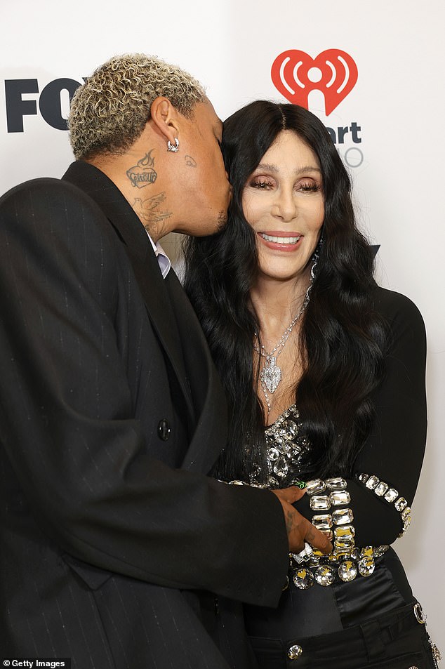 Alexander planted a kiss on her cheek as they strolled down the Dolby Theater Cher red carpet as she was honored at the 2024 iHeartRadio Music Awards last month