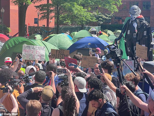 The Republican sat in the middle of the encampment, close to the statue of George Washington, which is unrecognizably wrapped in a Palestinian flag.