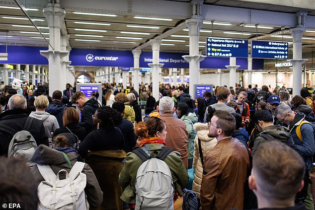 People queue for the Eurostar train services at St Pancras International station as they take their Easter holidays in London, Great Britain, March 29, 2024