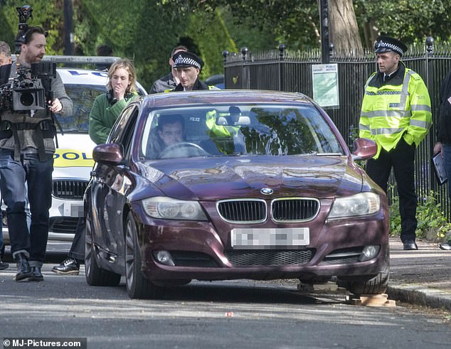 Before the scene, Jack was behind the wheel of a car when he was stopped and questioned by a police officer