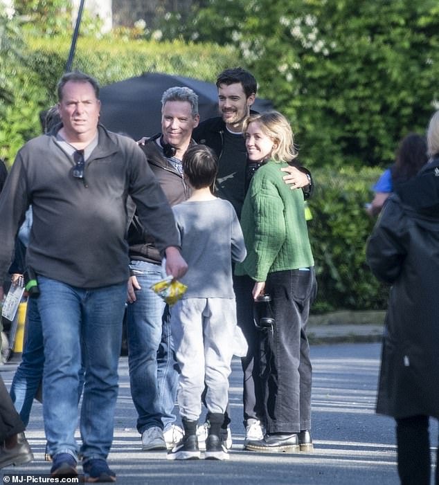 Jack posed for photos with members of the crew during a break from filming