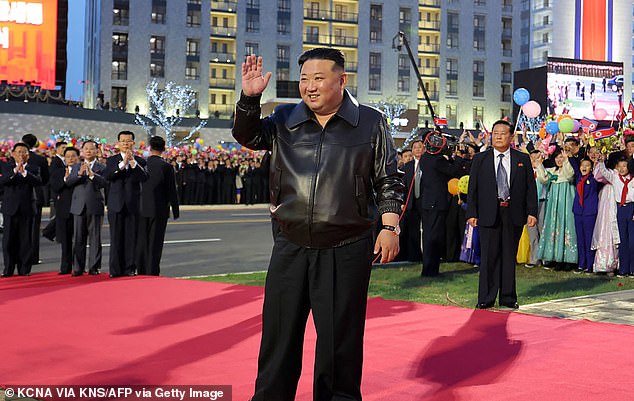 North Korean leader Kim Jong Un (C) attends a red carpet ceremony marking the completion of the second phase of a 10,000-home housing project in Pyongyang