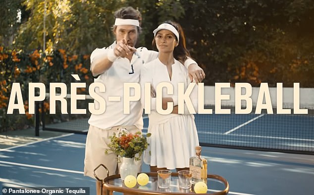 In the video promo, Matthew, 54, rolls a bar table onto a pickleball court and asks Camila, 