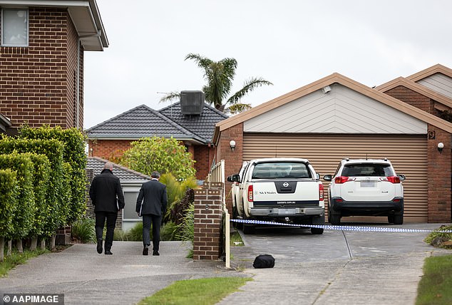 Detectives outside Ms Lezsak's parents' home in Endeavor Hills in May last year