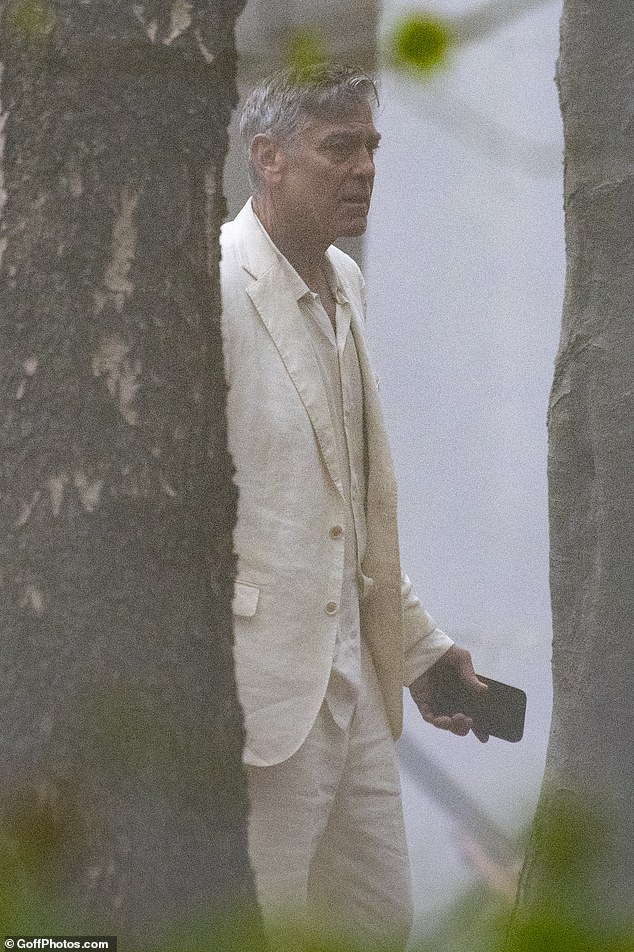 George was dressed in a cream-colored linen suit, which he teamed with a pair of suede loafers for the spooky scenes