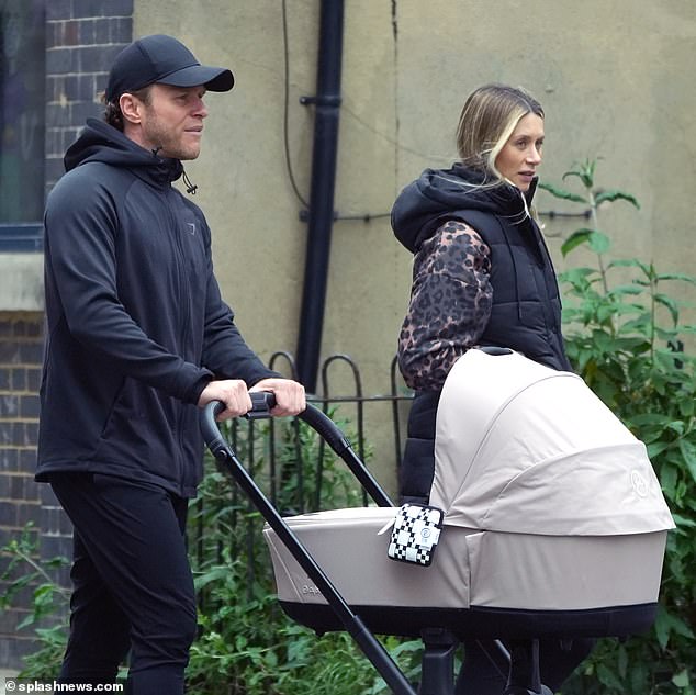 As the pair bundled up on the rainy day, the hitmaker pushed the stroller as he spent some quality time with his family after his recent run of shows