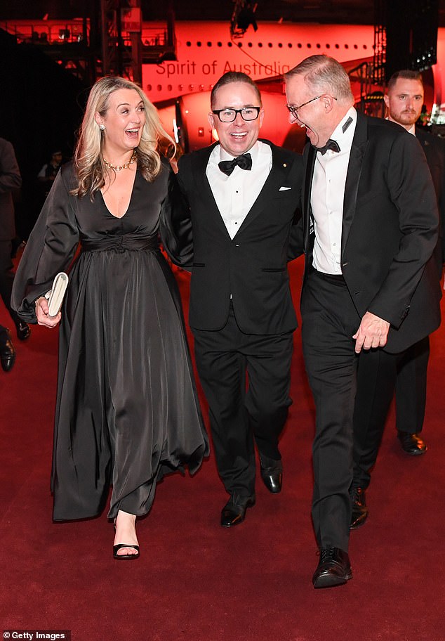 Ex-Qantas CEO Alan Joyce (pictured with Prime Minister Anthony Albanese and his girlfriend Jodie Haydon) accepted a billion dollar bailout to prevent Qantas from going bankrupt