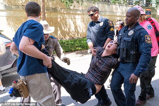 A pro-Palestinian protester is arrested at the University of Texas at Austin, Texas, on April 29
