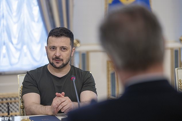 A photo made available by the Ukrainian Presidential Press Service shows Ukrainian President Volodymyr Zelensky holding a meeting with British Foreign Minister David Cameron (right) in Kiev today.