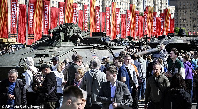 People visit an exhibition of Western military equipment captured by Russian forces in Ukraine, displayed at the World War II memorial complex on Poklonnya Hill in western Moscow, May 1