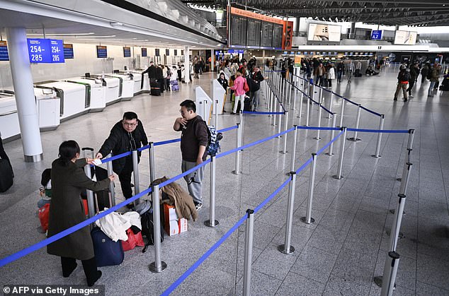 Pictured: Passengers are seen at Frankfurt Airport in February (archive photo)