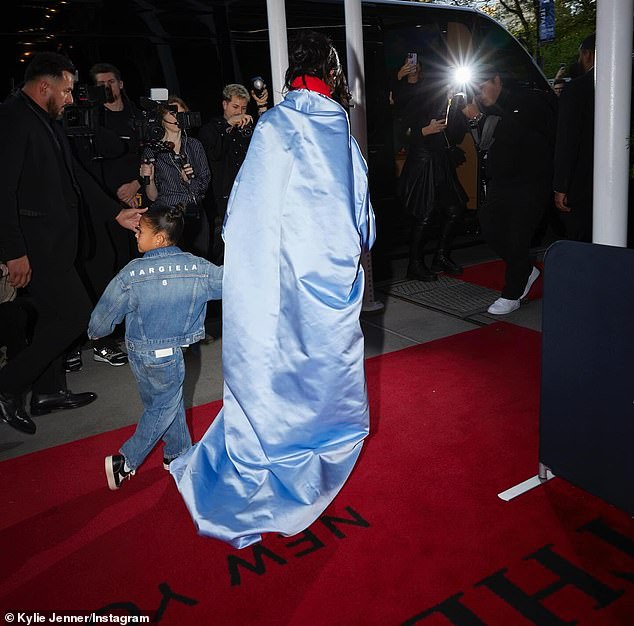 The reality star captured hearts with these photos as she and daughter Stormi, six, walked past a group of photographers ready to capture the looks from the high fashion evening