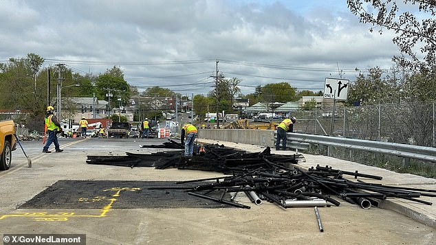 On Friday, crews began demolishing the damaged bridge using excavators