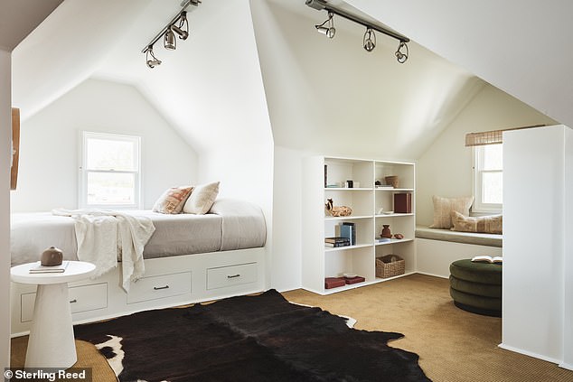 The attic adds 378 square feet to the home for alcove seating, additional built-in storage, and a daybed