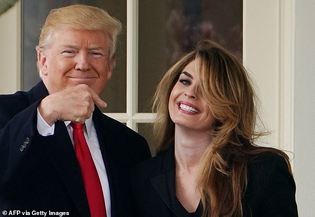 US President Donald Trump poses for a photo with former communications director Hope Hicks outside the Oval Office in 2018