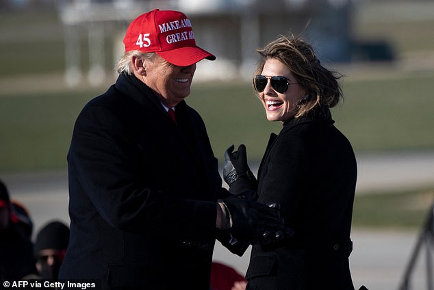 Hope Hicks smiles at U.S. President Donald Trump during a Make America Great Again rally at Dubuque Regional Airport on November 1, 2020 in Dubuque, Iowa