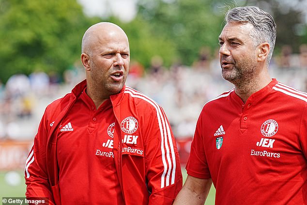 The Feyenoord head coach (left) is believed to be on the verge of confirming his move to Anfield