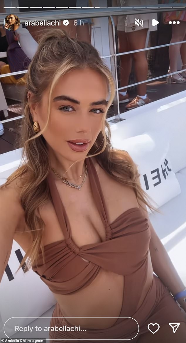 The TV personality, 33, showed off her endless legs in a very skimpy brown mini dress with a halter neck and cut-out details on the bust, exposing her flat stomach.