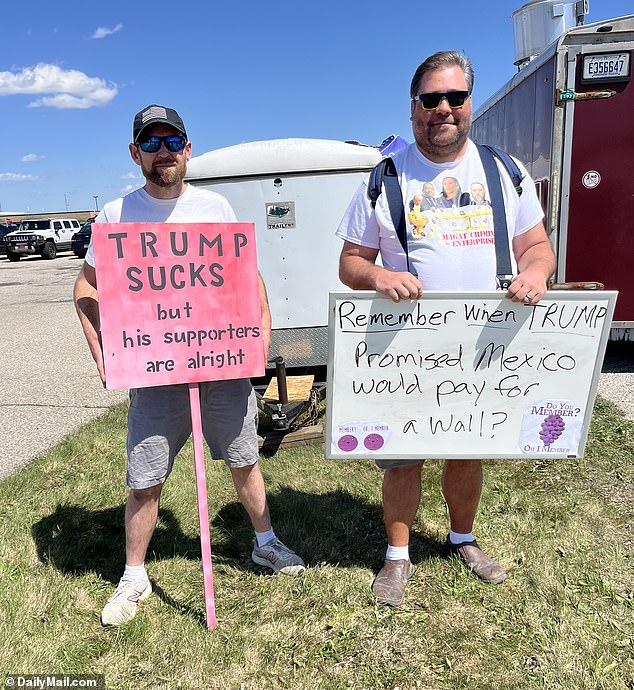 Anti-Trump protesters stood outside the ex-president's rally in Freeland, Michigan, as supporters lined up to get in