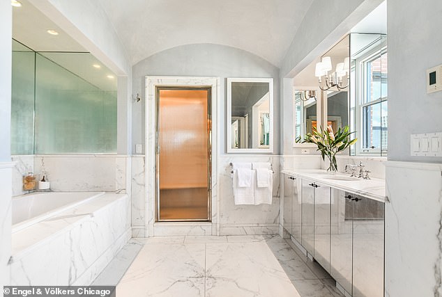 The multi-story townhouse also has five full bathrooms and two half baths