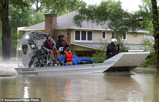 A woman is rescued from her home by airboat by Montgomery County Sheriff's Office deputies