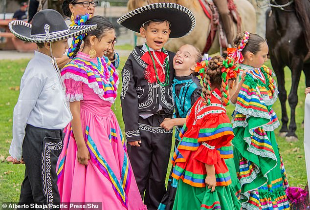 Children were also seen dressed in vibrant colors and sombreros, while the girls wore colorful ribbons in braided hair