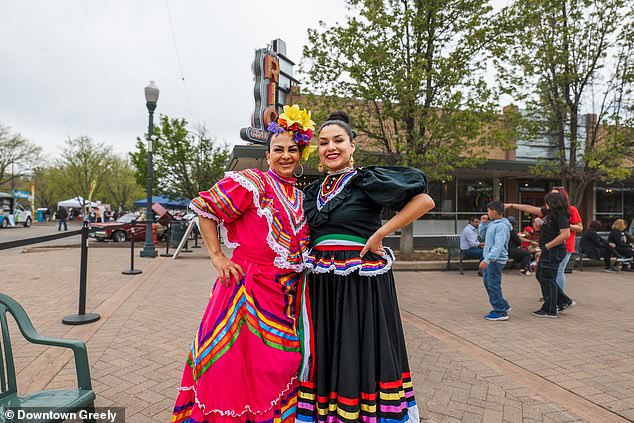 In Greely, Colorado, women were seen dressed in long, layered, bright dresses with large flowers in their hair