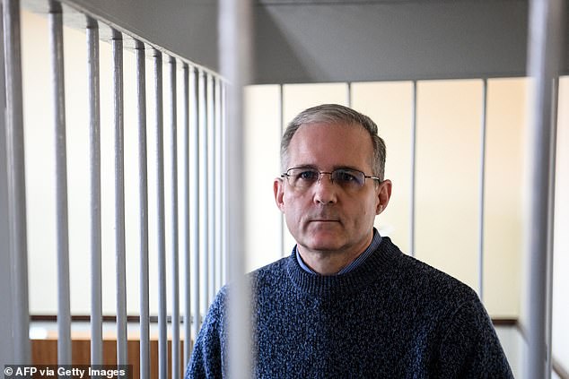 Paul Whelan, a former US Marine accused of espionage and arrested in Russia, stands in a defendant's cage during a hearing in a Moscow court on August 23, 2019