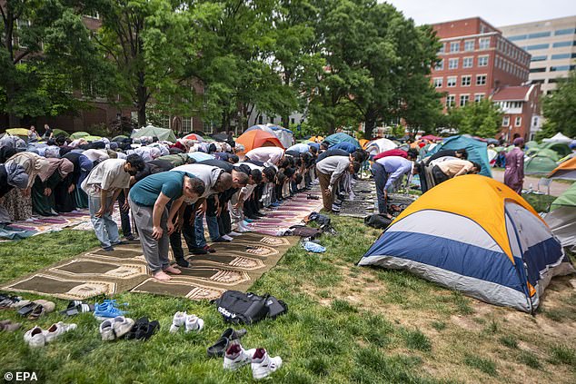 Students on college campuses across the US have set up encampments and pro-Palestinian demonstrations in recent weeks to amplify calls for a ceasefire from Israel.  Pictured: Protesters participate in prayer at the anti-Israel encampment at George Washington University in DC on Friday, May 3