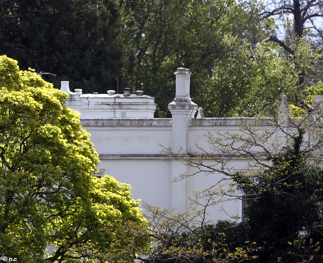 Parts of the building have turned gray where they were once bright, iconic white