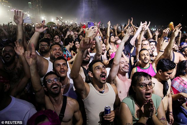 During the 65-year-old's free concert, the beach turned into a gigantic dance floor.  There was a carnival atmosphere, reportedly without incident, as the crowd turned out en masse to party to her iconic songs including Holiday and Like A Virgin.