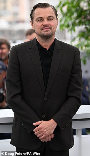 He was first seen with his hand on her bottom during the filming of their Paul Thomas Anderson movie.  The two were then photographed cuddling at an Oscar party;  He is pictured on April 11