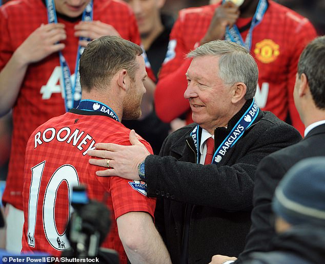 Sir Alex Ferguson (R) and Wayne Rooney (L) barely acknowledged each other during the iconic manager's final trophy lift in the Premier League with Manchester United