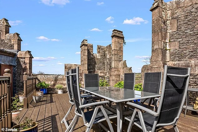 The roof terrace offers space for dining, with a table that can comfortably seat six guests