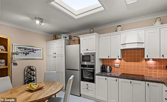 The kitchen of the penthouse has a skylight that allows a lot of light to enter the room