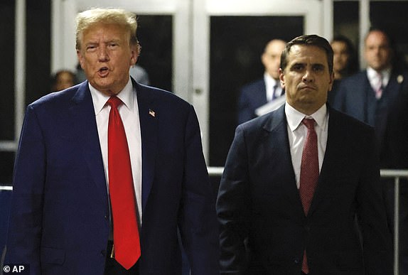 Former President Donald Trump, left, speaks to reporters while accompanied by his lead attorney, Todd Blanche, after leaving court following his hush money trial in New York, Monday, May 6, 2024. (Peter Foley/Pool Photo via AP)