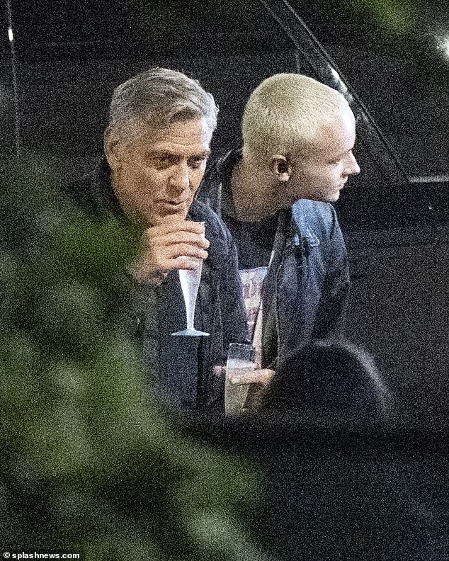 George was seen enjoying a birthday drink as he left the party