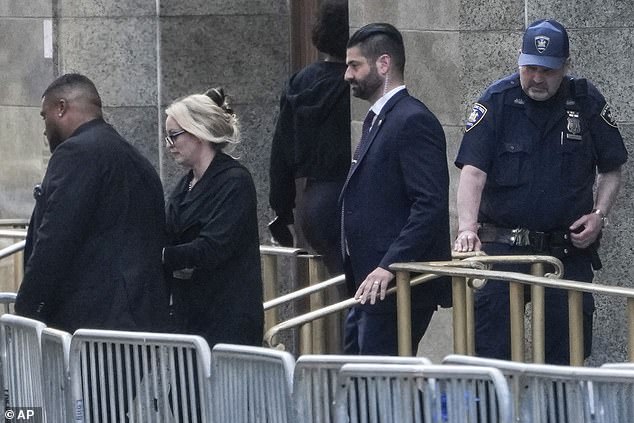 Daniels leaves Manhattan Criminal Court on Tuesday evening.  She will be back on Thursday