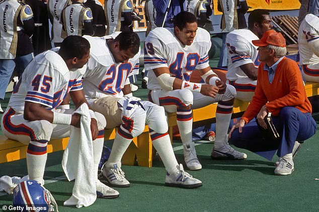 Collier talks to Broncos DBs Steve Wilson, Louis Wright and Dennis Smith in a 1985 game