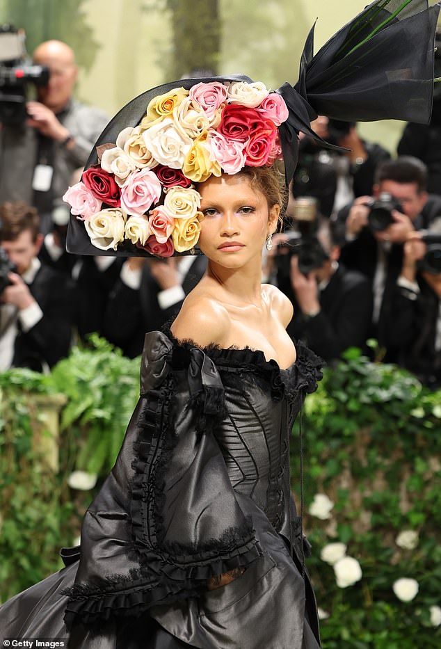 The actress added a large floral headpiece with colorful shades of red, pink, orange and also white