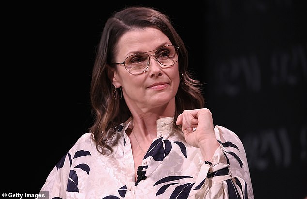 The actress wore glasses and accessorized with silver earrings