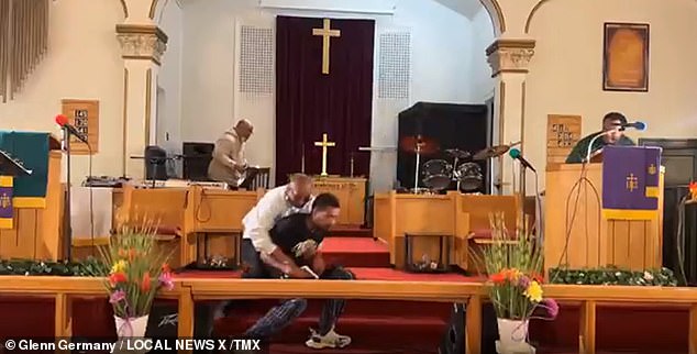 Miraculously, no bullet came out and the shooter was immediately tackled by church deacon Clarence McCallister, who jumped in front of the camera and tackled the perpetrator to the ground.