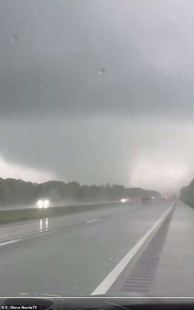 Pictured: Footage of a large tornado crossing US Route 31 near Kalamazoo, MI