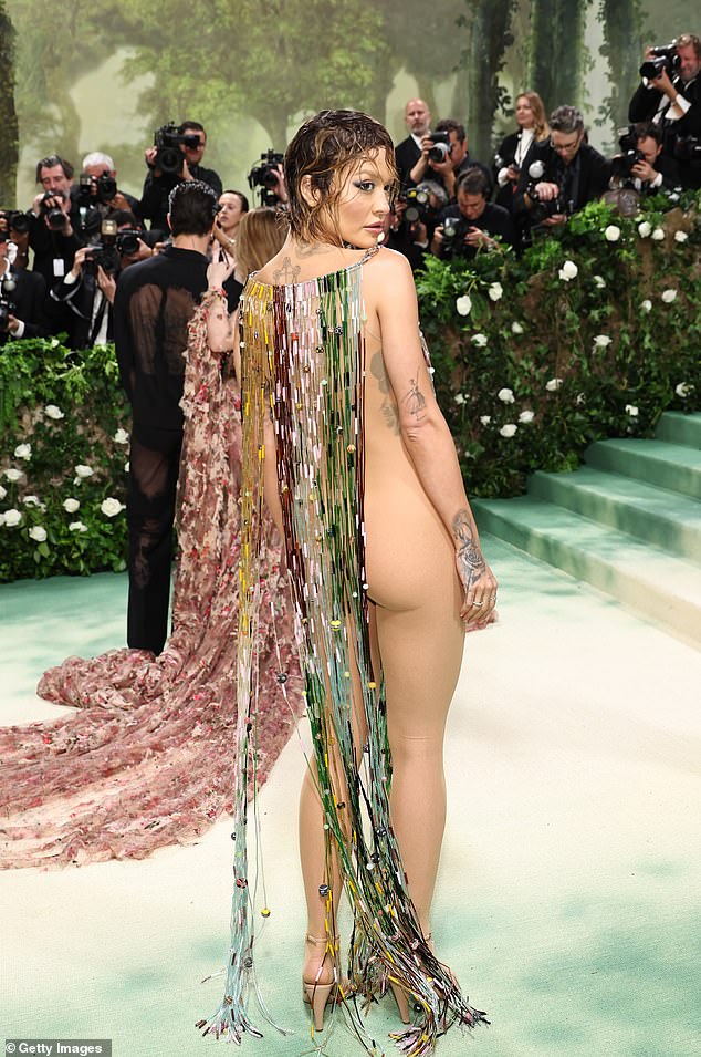 Arriving on the red carpet, the Body On Me singer put on a very daring show in a sheer nude bodysuit under an intricately beaded dress, left open at the sides