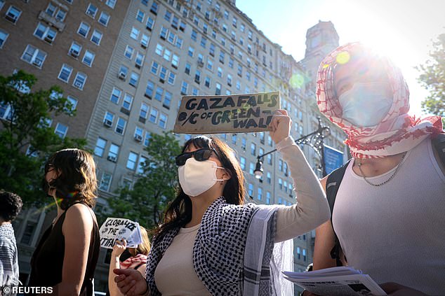 Columbia University students protest outside the homes of university officials