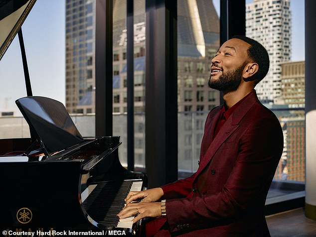 John dressed in a smart red suit and took to the piano in the luxury suite of his room as part of the advertisement