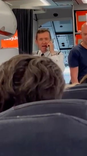 Passengers on a flight from Lisbon to Manchester were left stunned when the pilot (pictured on Sunday) admitted he held up their flight because he 'couldn't give the crew sandwiches'