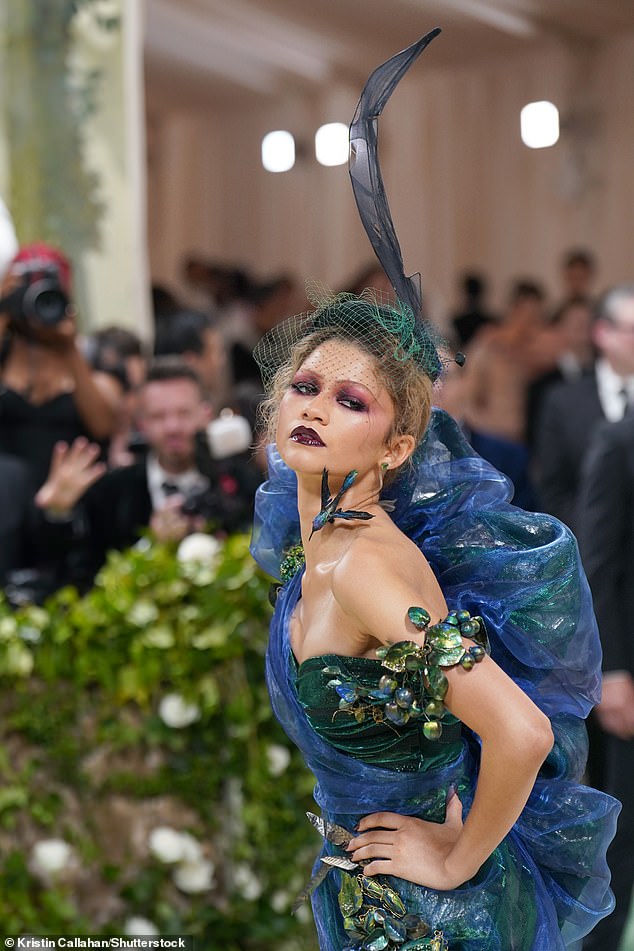 Gala co-chair Zendaya was an early carpet walker who looked like a giant boutonniere while doing that laughably awkward dying turtle pose.