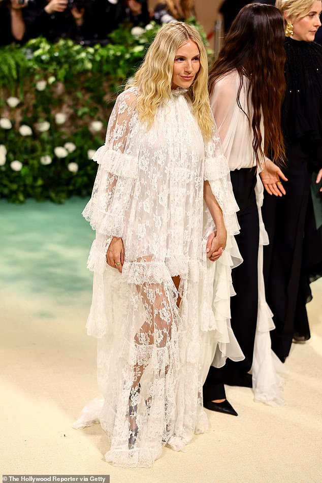 The actress showed off her boho-inspired fashion sense in a flowing white lace dress, four months after the birth of her second child