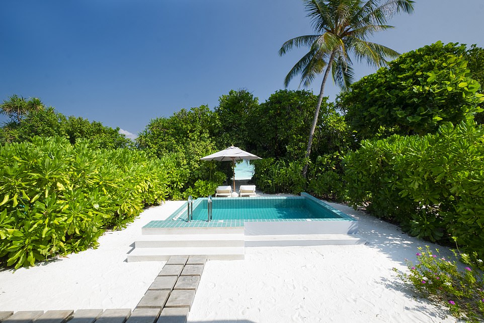 Beach life: Carol describes the sand at the resort as 'powdery and pristine'